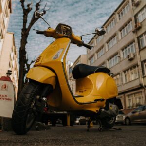 Yellow scooter parked.